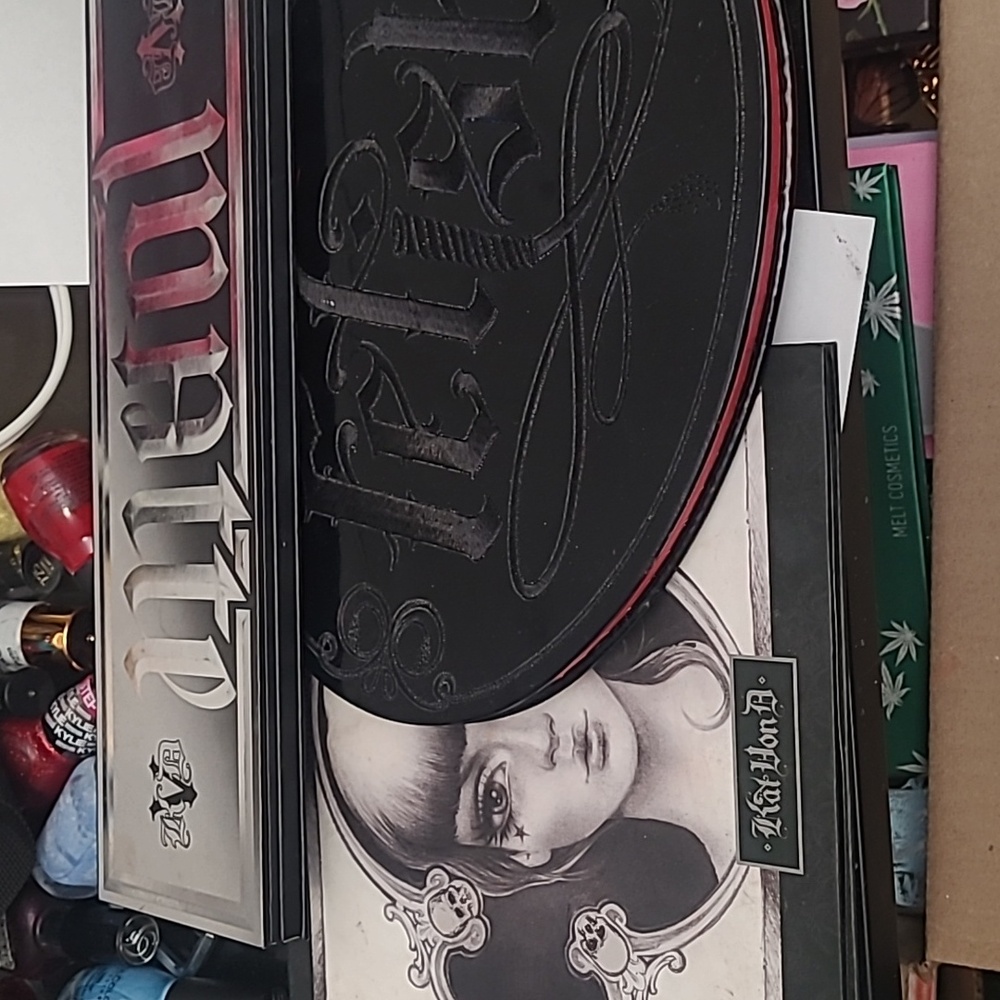 3 Empty Kat Von D palettes.